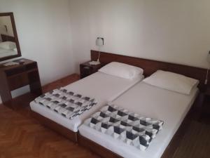 Posteľ alebo postele v izbe v ubytovaní Apartments Katarina