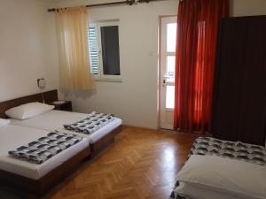 Posteľ alebo postele v izbe v ubytovaní Apartments Katarina