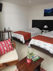 Ένα ή περισσότερα κρεβάτια σε δωμάτιο στο Pandora hotel colca