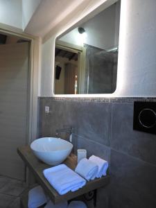 a bathroom with a sink and a mirror at Acquamaris Tuerredda in Teulada