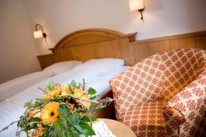 Posteľ alebo postele v izbe v ubytovaní Hotel-Garni Jakober