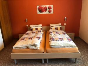 Postel nebo postele na pokoji v ubytování Ferienhaus Perle