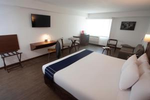 a hotel room with two beds and a television at Casa Andina Select Miraflores in Lima