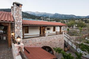 a stone house with a view of the mountains at ARADENA TRADITIONAL House 1 in Arádhaina