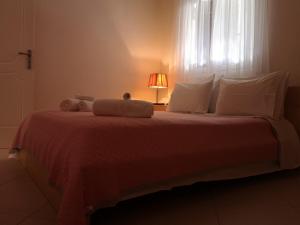 Llit o llits en una habitació de Eleni Apartment