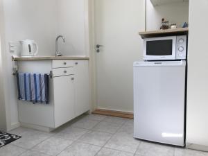 A kitchen or kitchenette at Charm Inn