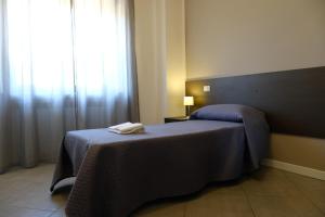 A bed or beds in a room at B&B Grandangolo