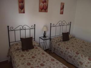 Postel nebo postele na pokoji v ubytování Hostal El Canario