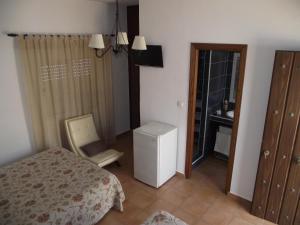 Postel nebo postele na pokoji v ubytování Hostal El Canario