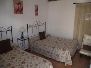 Postel nebo postele na pokoji v ubytování Hostal El Canario