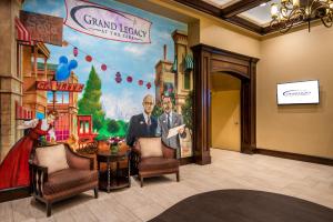 a mural of a man and a woman standing in a room at Grand Legacy At The Park in Anaheim