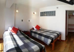 Postel nebo postele na pokoji v ubytování Real House Cusco