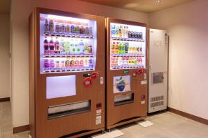 two vending machines in a room with drinks at S-peria Hotel Kyoto in Kyoto