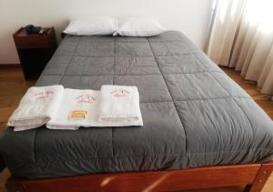 Postel nebo postele na pokoji v ubytování Real House Cusco