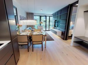 a kitchen and dining room with a table and chairs at White Pearl Apartment 1.02 in Timmendorfer Strand