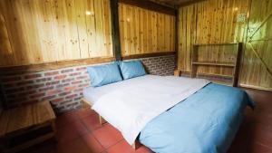 Postel nebo postele na pokoji v ubytování Joy House Sapa