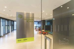 a glass wall with a sign in a building at the base condo 88/96 in Pattaya Central +23 photos