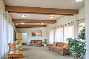 a lobby with couches and tables and windows at Quality Inn Big Sky in Kalispell