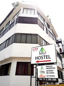 a building with a hospital sign in front of it at Miracle Colombo City Hostel in Colombo