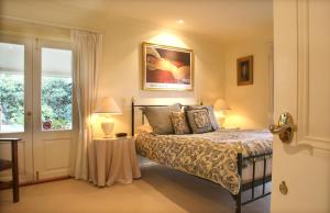 A bed or beds in a room at Midnights Promise Estate