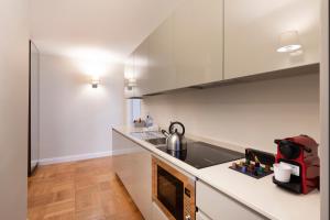 Kuchyňa alebo kuchynka v ubytovaní Milano Manzoni CLC Apartments