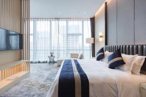 Voodi või voodid majutusasutuse Chongqing Liyuan Hotel toas