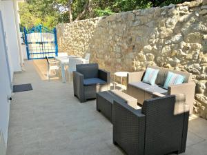 Posedenie v ubytovaní Oudeis Holidays Apartments Tropea