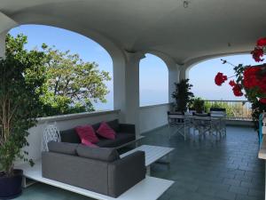 a living room with a couch and a table at Sorrento Garden in Sorrento