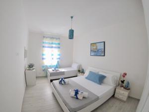 Posteľ alebo postele v izbe v ubytovaní Oudeis Holidays Apartments Tropea