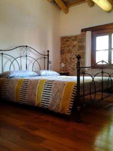 Un pat sau paturi într-o cameră la Alloggio Agrituristico Conte Ottelio