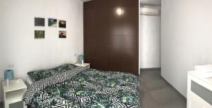 Posteľ alebo postele v izbe v ubytovaní Flatguest - Cozy Beach