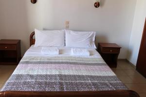Postel nebo postele na pokoji v ubytování Pantelis Rooms Skopelos