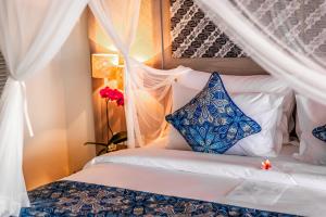 Voodi või voodid majutusasutuse Nirwana Beach & Resort toas