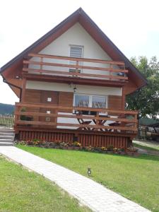 a home with a large wooden house at Agroturystyka Domek u Barbary in Lesko