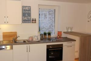 a kitchen with a sink and a counter top at Fewo Simone - Überlingen City - in Überlingen +15 photos