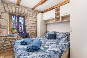 Posteľ alebo postele v izbe v ubytovaní Rural holiday home Stankolina Opatija