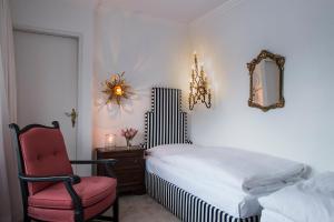 Postel nebo postele na pokoji v ubytování A-ROSA Collection Hotel Thurnher's Alpenhof