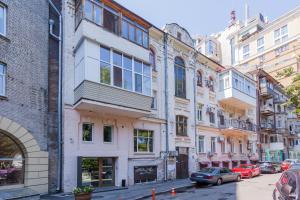 a row of buildings on a city street at Mini Hotel near Arena City in Kyiv