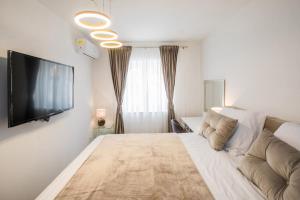 Ένα ή περισσότερα κρεβάτια σε δωμάτιο στο Apartment Dioclessima