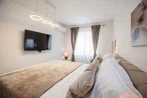 Postel nebo postele na pokoji v ubytování Apartment Dioclessima