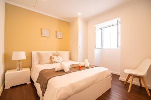 a small bedroom with a bed and a window at Casa do Outeiro with Heated Pool 30C in Povoação +37 photos