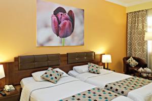 Ein Bett oder Betten in einem Zimmer der Unterkunft Three Corners Rihana Resort El Gouna