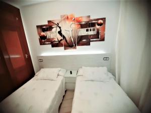 Posteľ alebo postele v izbe v ubytovaní Hostal Kokkola