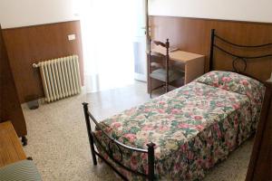 Ένα ή περισσότερα κρεβάτια σε δωμάτιο στο Oasi di Pace