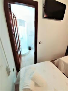 Posteľ alebo postele v izbe v ubytovaní Hostal Kokkola