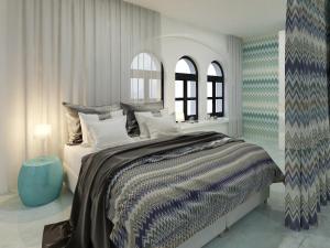 a bedroom with a large bed and two windows at City Park Hotel & Residence in Poznań