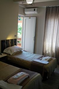 Letto o letti in una camera di Ponto Hotel