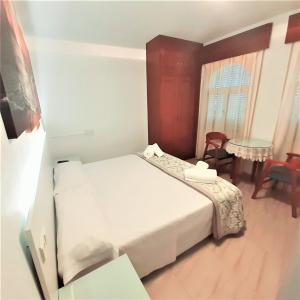 Posteľ alebo postele v izbe v ubytovaní Hostal Kokkola