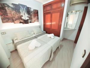 Posteľ alebo postele v izbe v ubytovaní Hostal Kokkola