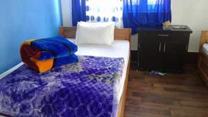 Postel nebo postele na pokoji v ubytování Vamoose Yakchiri